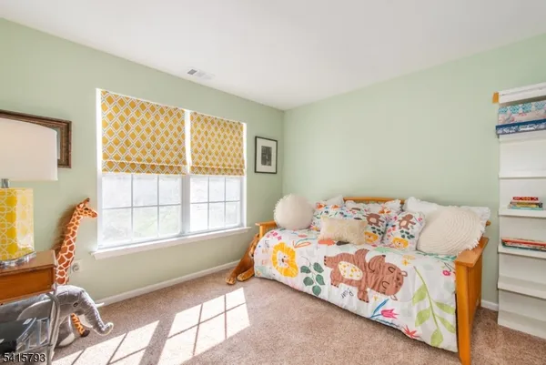 a bed room with a bed and a window