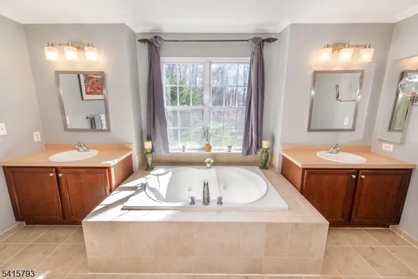 a bath tub sitting in a bathroom with sink