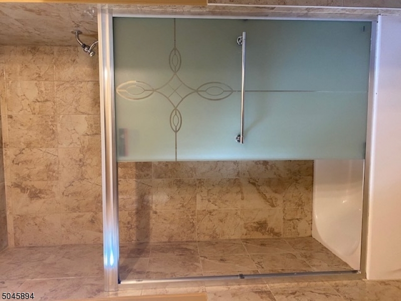 25 Cottage Street, Unit 4 Newark, NJ 07102 - Photo 11 of 13 a bathroom with a shower