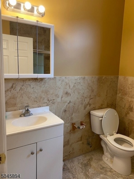 25 Cottage Street, Unit 4 Newark, NJ 07102 - Photo 12 of 13 a bathroom with a sink and a toilet