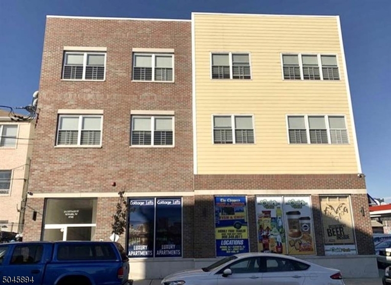 25 Cottage Street, Unit 4 Newark, NJ 07102 - Photo 13 of 13 a front view of a building with parking space