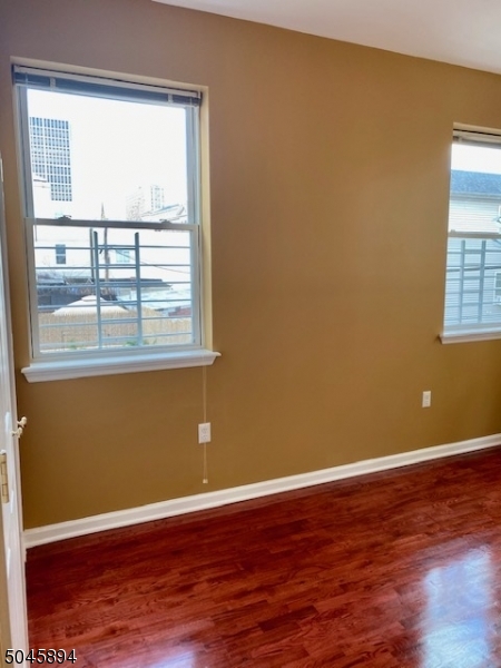 25 Cottage Street, Unit 4 Newark, NJ 07102 - Photo 8 of 13 a view of a room with wooden floor and a window
