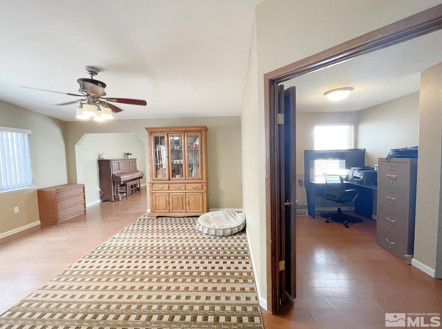 562 Yellow Jacket Road Dayton, NV 89403 - Photo 15 of 27 a living room with furniture and a chandelier