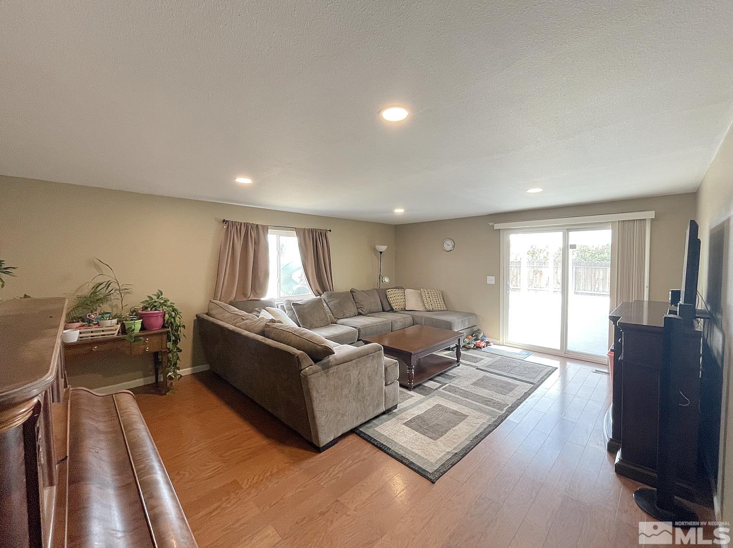 562 Yellow Jacket Road Dayton, NV 89403 - Photo 16 of 27 a living room with furniture and a window
