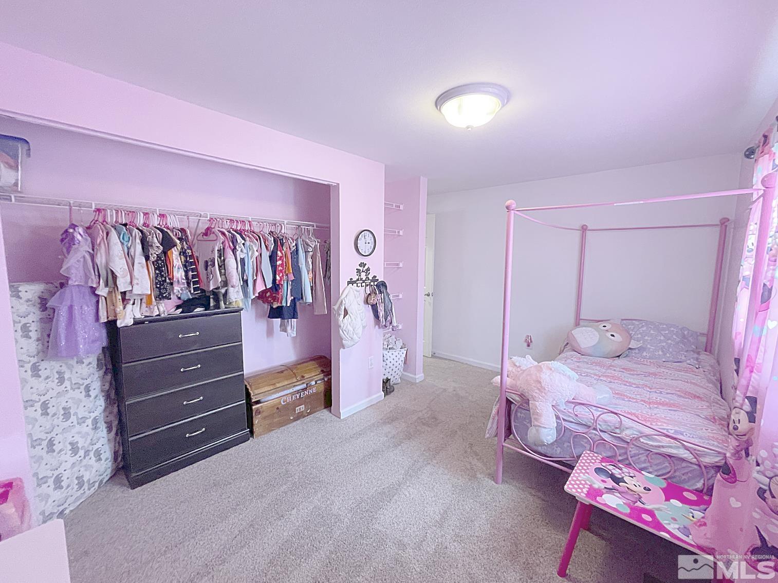 562 Yellow Jacket Road Dayton, NV 89403 - Photo 18 of 27 a bedroom with a bed and a mirror