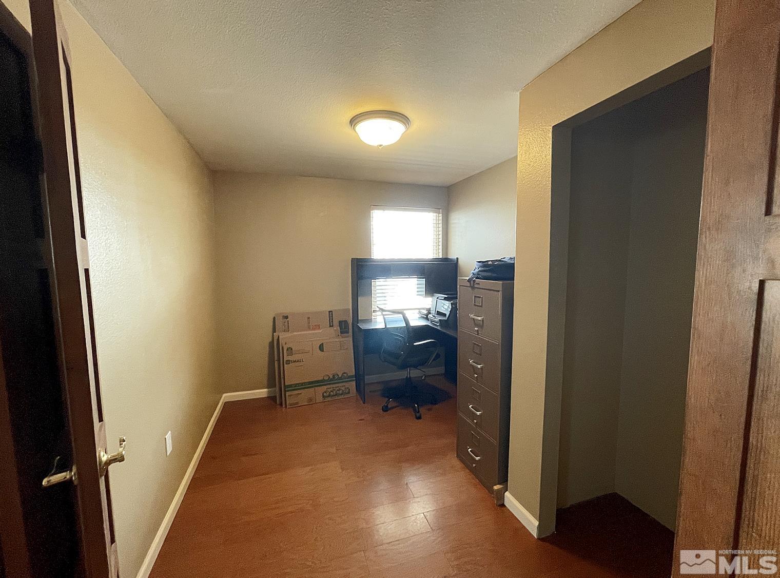 562 Yellow Jacket Road Dayton, NV 89403 - Photo 20 of 27 a room with furniture and a gate