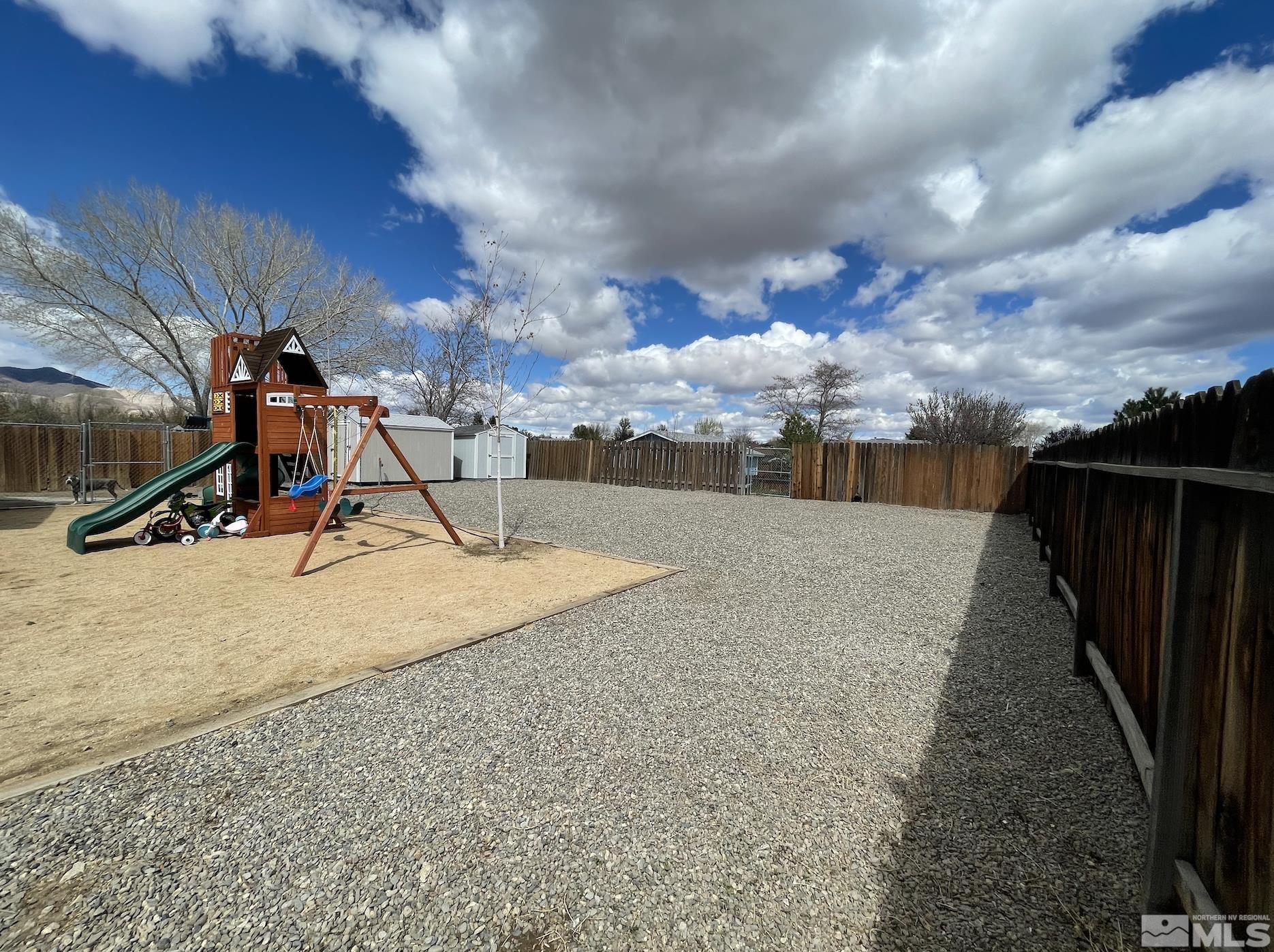 562 Yellow Jacket Road Dayton, NV 89403 - Photo 22 of 27 a view of a park with swings and slides