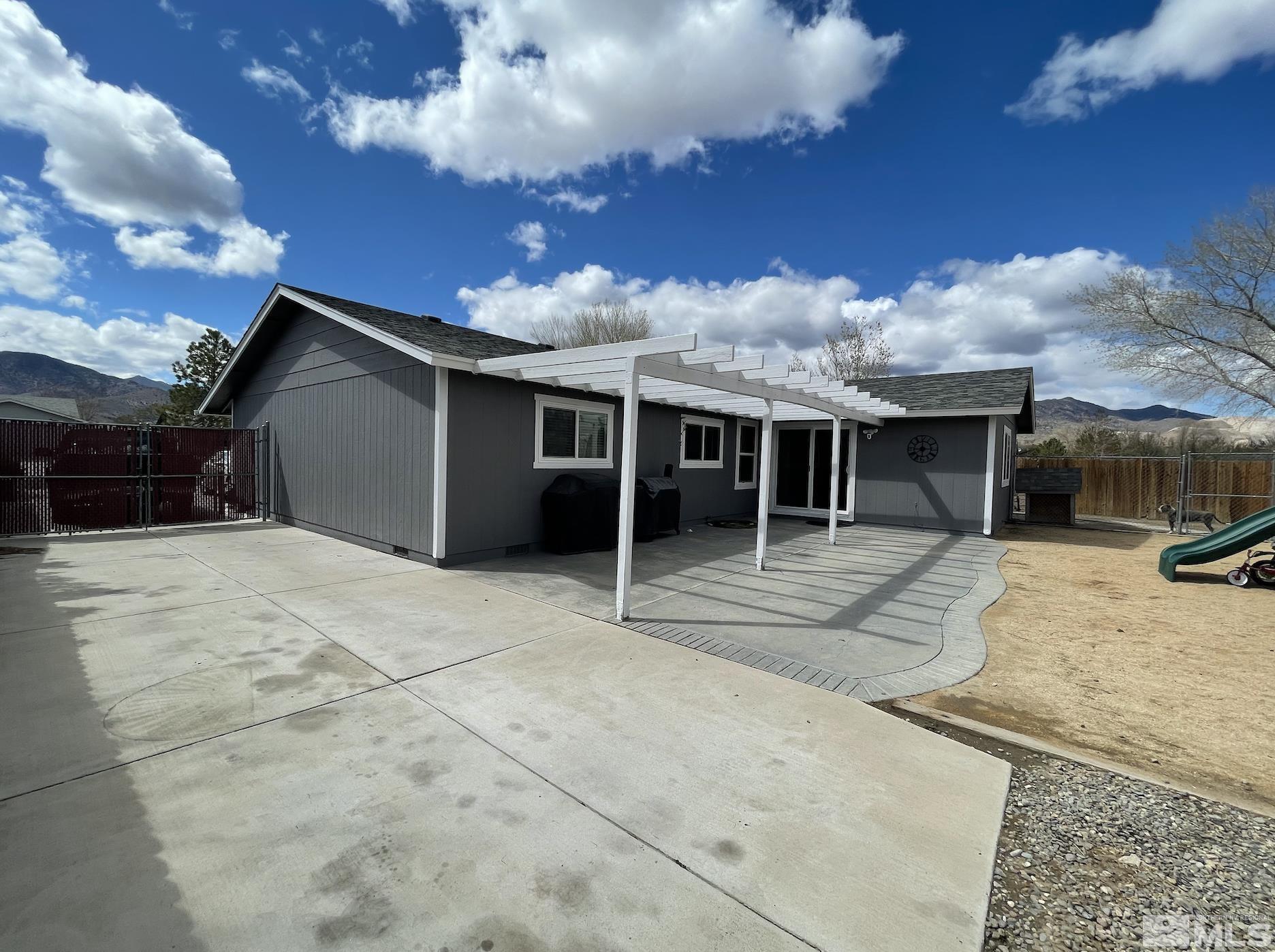 562 Yellow Jacket Road Dayton, NV 89403 - Photo 27 of 27 a view of a house with a patio