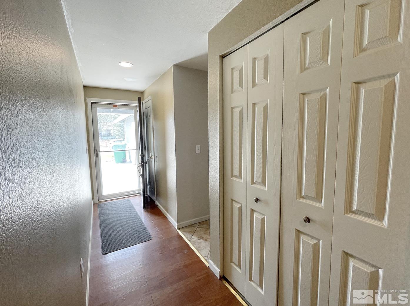 562 Yellow Jacket Road Dayton, NV 89403 - Photo 5 of 27 a view of a hallway with wooden floor