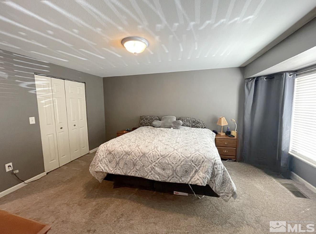 562 Yellow Jacket Road Dayton, NV 89403 - Photo 10 of 27 a bedroom with a bed and a window