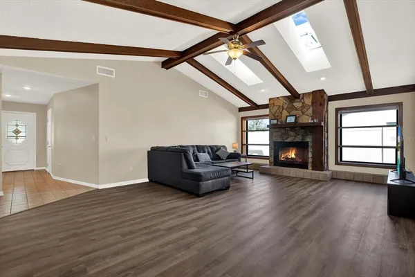 a living room with furniture and a fireplace