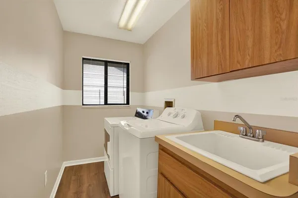 a utility room with dryer and washer