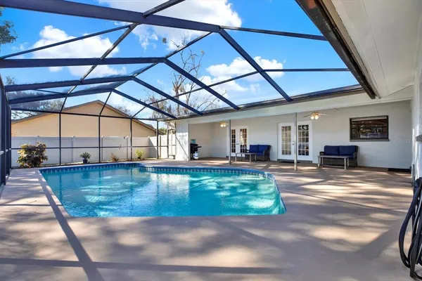 a view of a swimming pool with a patio