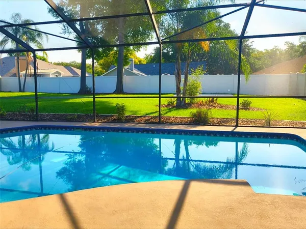 a view of a swimming pool with a porch