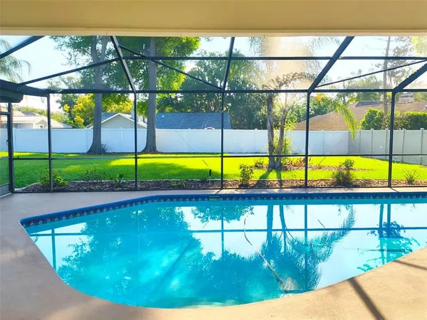 a view of a swimming pool with a porch