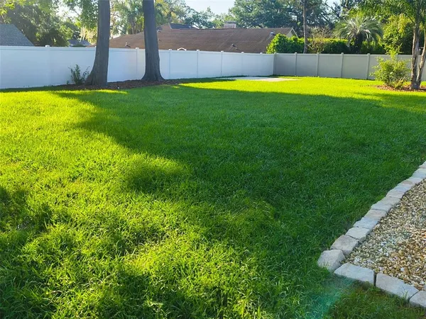a view of a backyard with a small pool