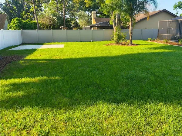 a view of swimming pool with a yard