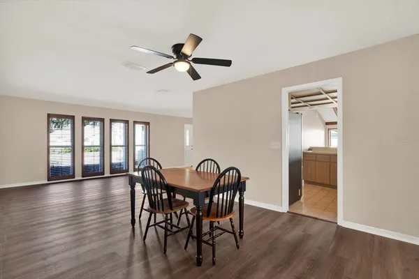a view of a dining room with furniture and window