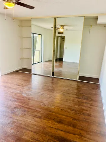 an empty room with wooden floor