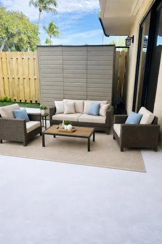 a outdoor living space with furniture and a couch
