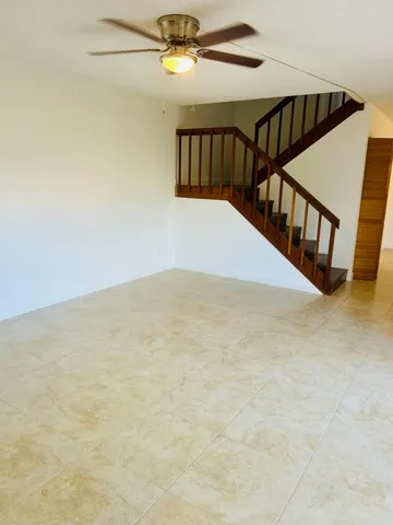 a view of a kitchen with stainless steel appliances granite countertop a stove and a sink