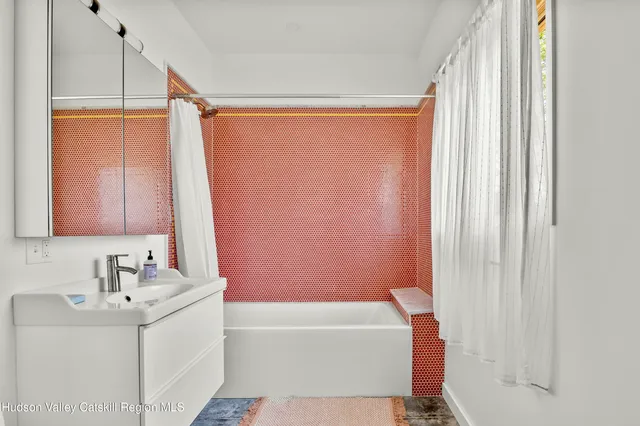 a bathroom with a sink and a bathtub
