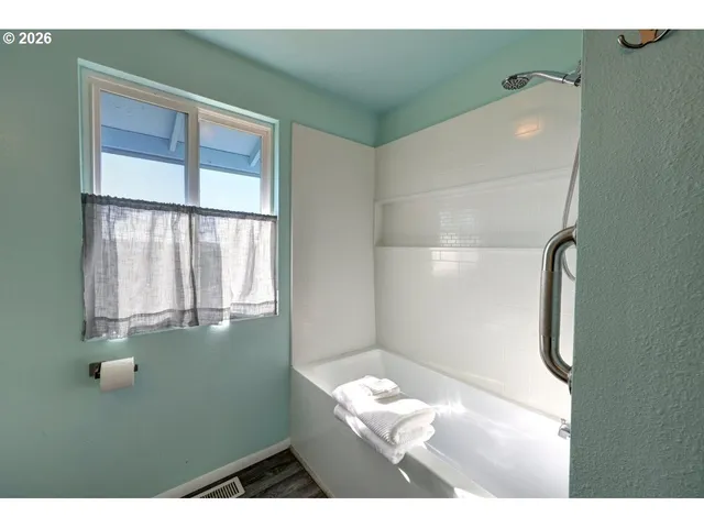a kitchen with granite countertop a sink and cabinets