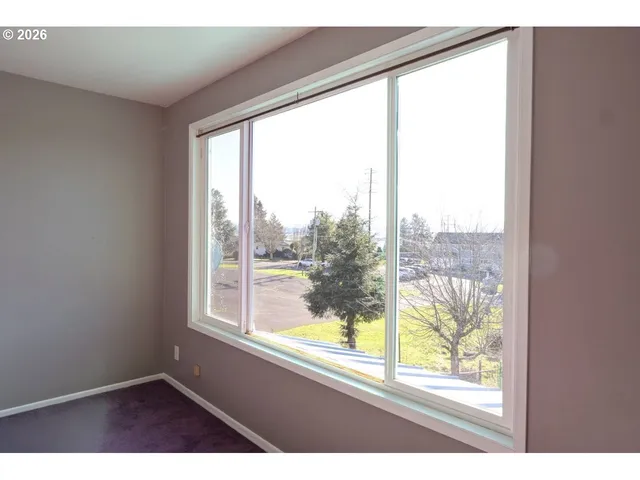 a view of an empty room and window