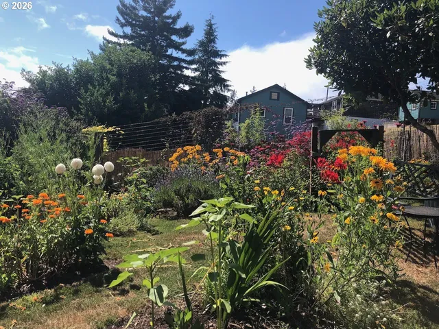 an aerial view of a swimming pool with outdoor seating