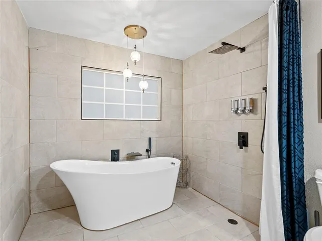 a white bath tub sitting in a bathroom