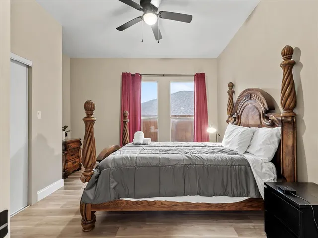 a bedroom with a bed and window