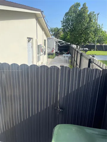 a view of outdoor space with deck and furniture