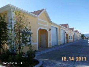624 Atlantis Road, Unit 101 Melbourne, FL 32904 - Photo 1 of 2 a view of a house with a yard