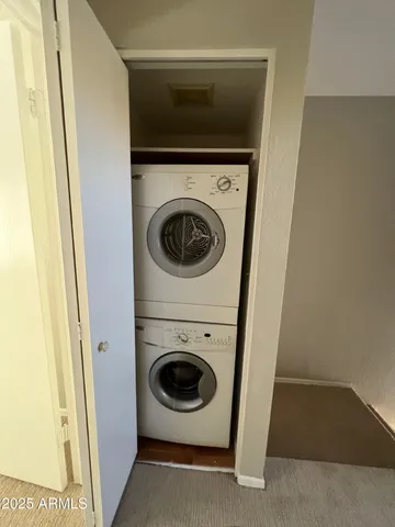 a view of a room with a ceiling fan