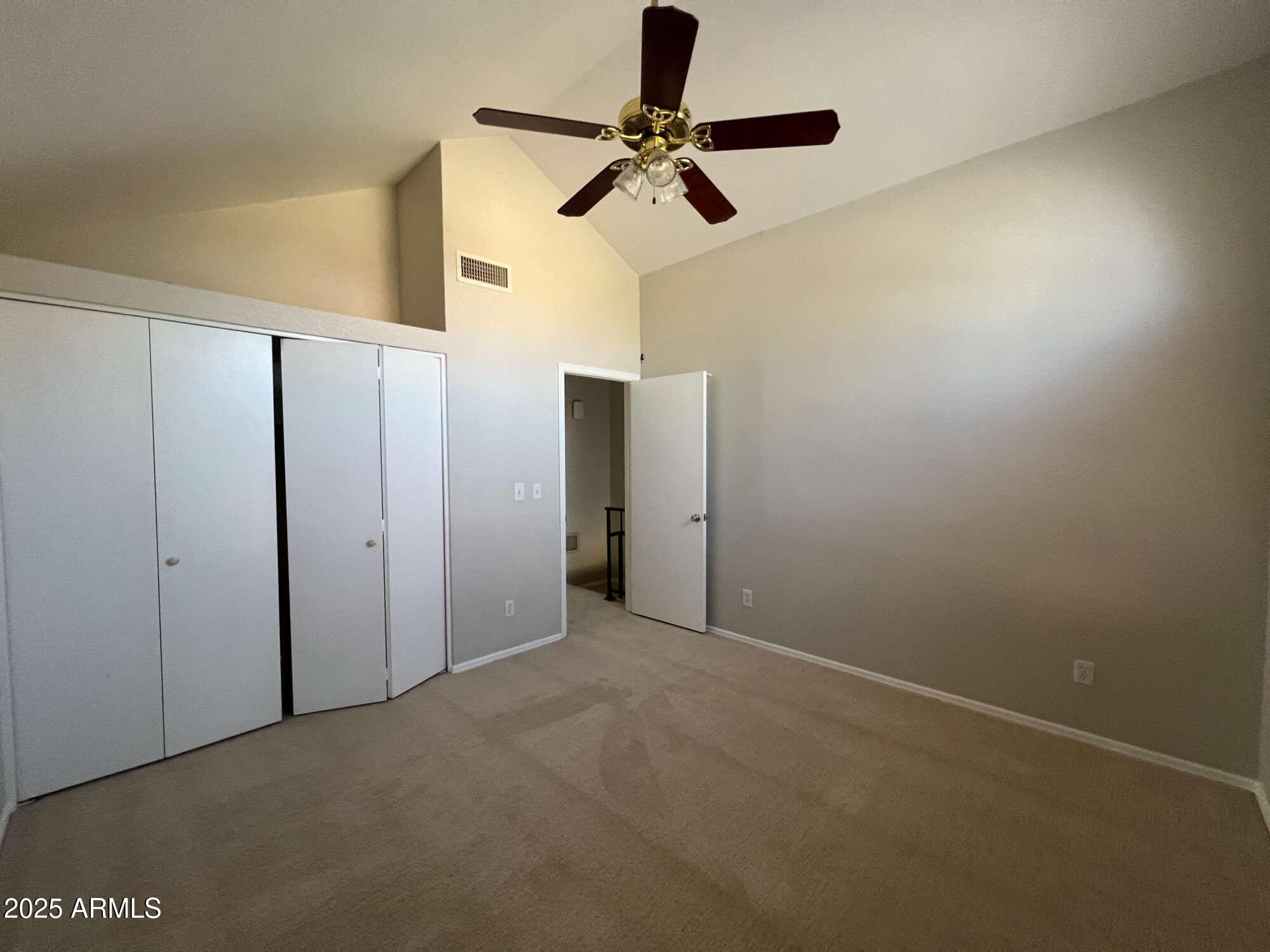 5704 East Aire Libre Avenue, Unit 1081 Scottsdale, AZ 85254 - Photo 14 of 18 a view of a room with a ceiling fan