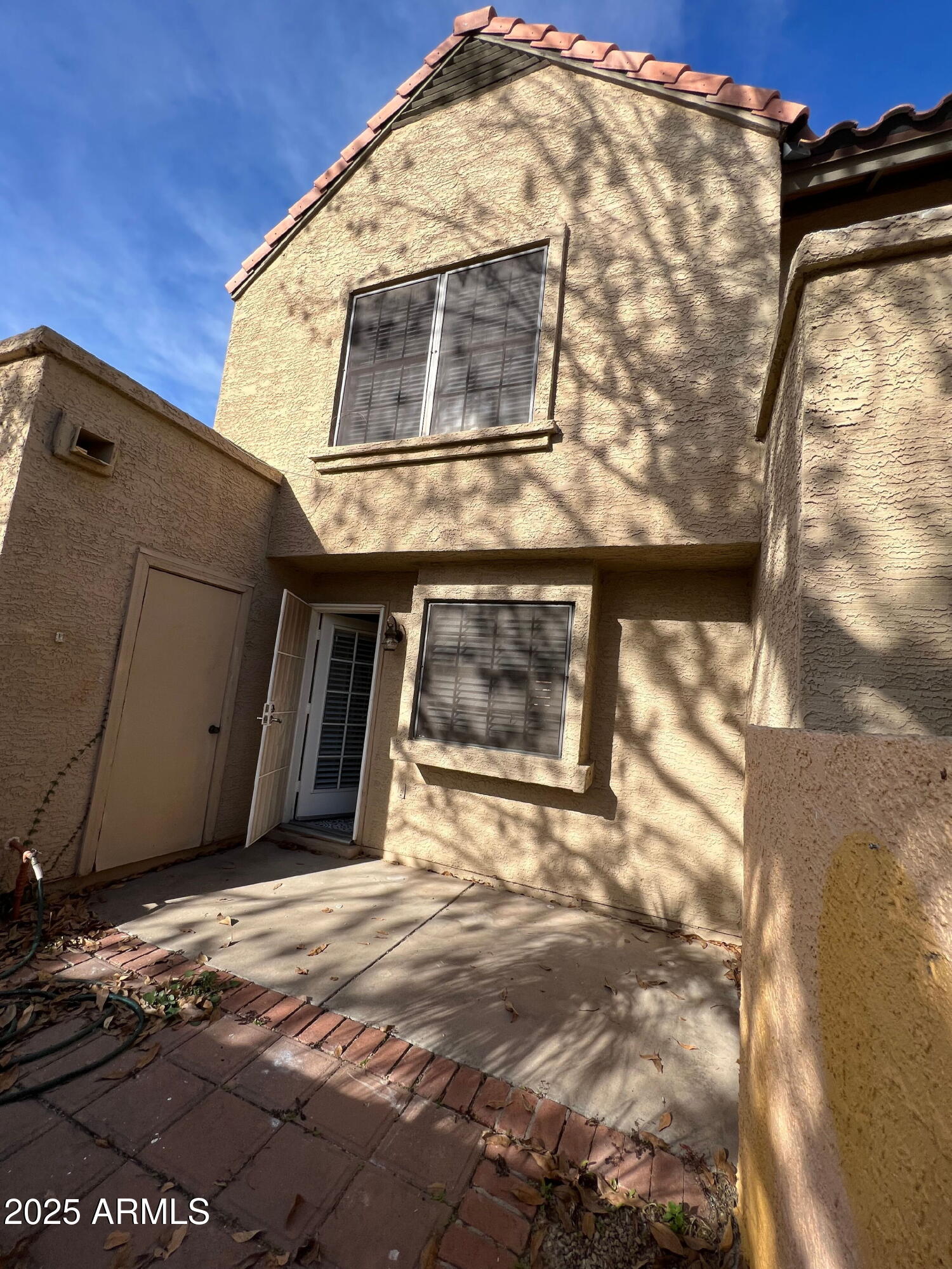 5704 East Aire Libre Avenue, Unit 1081 Scottsdale, AZ 85254 - Photo 17 of 18 a view of a house with a door