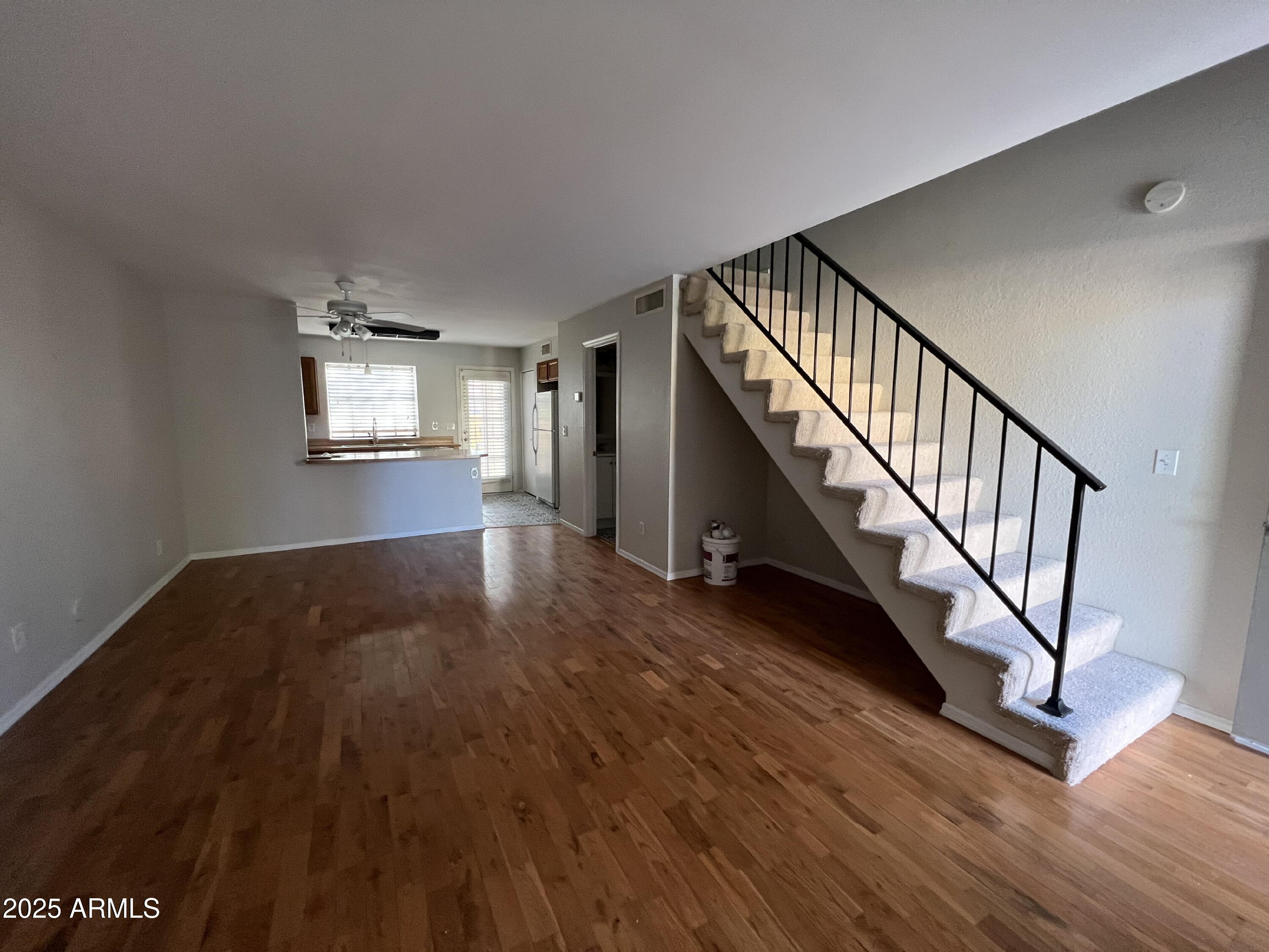 5704 East Aire Libre Avenue, Unit 1081 Scottsdale, AZ 85254 - Photo 4 of 18 a view of an entryway with wooden floor