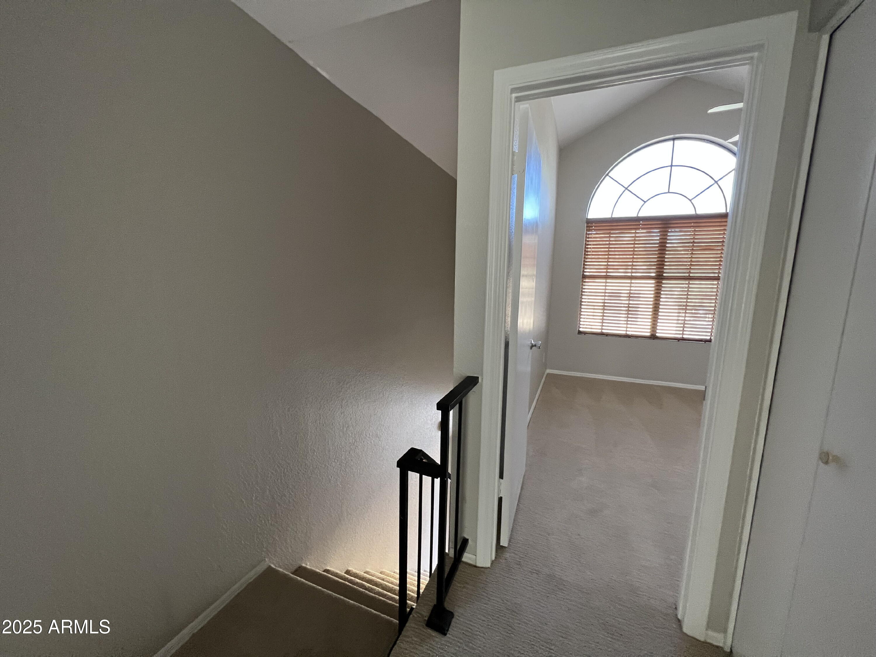 5704 East Aire Libre Avenue, Unit 1081 Scottsdale, AZ 85254 - Photo 7 of 18 wooden floor and window in a room