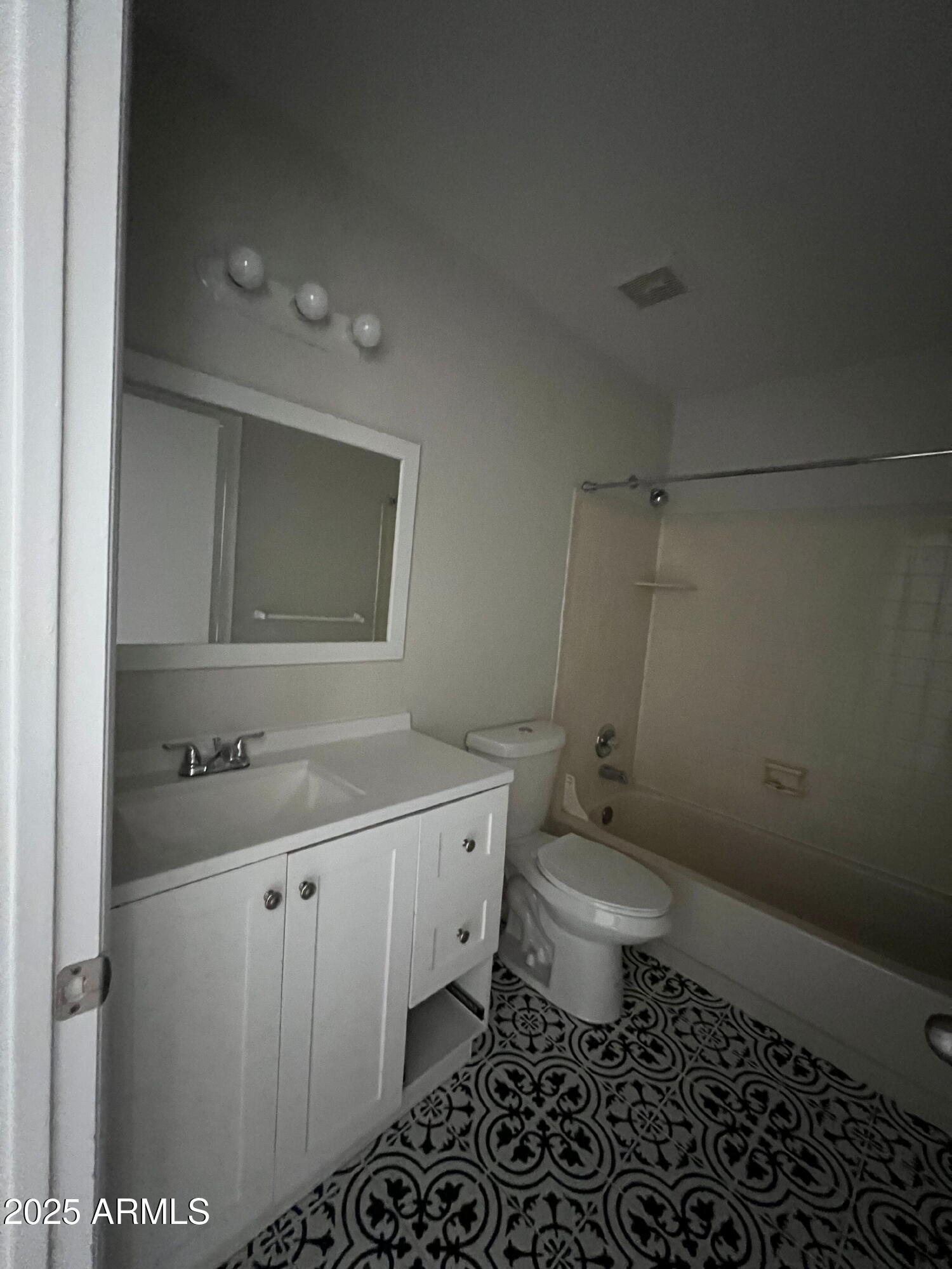 5704 East Aire Libre Avenue, Unit 1081 Scottsdale, AZ 85254 - Photo 9 of 18 a bathroom with a granite countertop sink a toilet and a mirror
