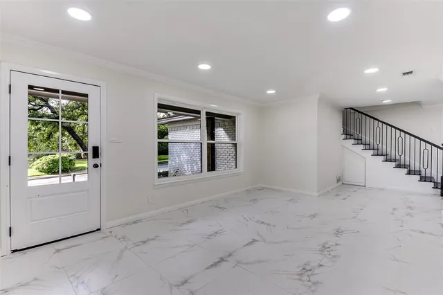 a view of an empty room with a window