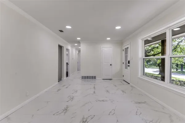 a view of an empty room with a window