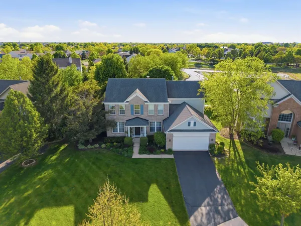 an aerial view of a house with a garden