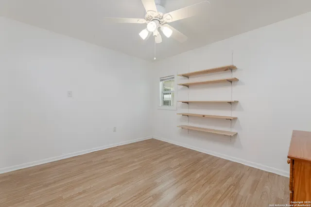 a view of a room with rack and wooden floor