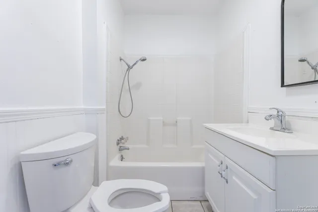 a bathroom with a sink a toilet and a bathtub