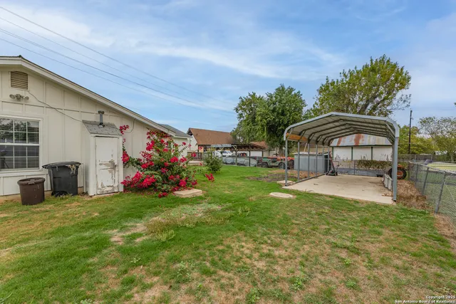 a view of a house with swimming pool and sitting area