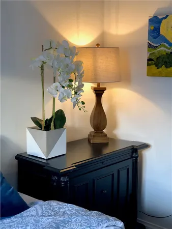a room with table and potted plant