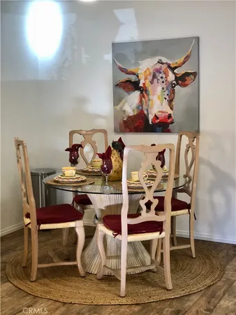 a view of a dining room with furniture on the wall and a rug