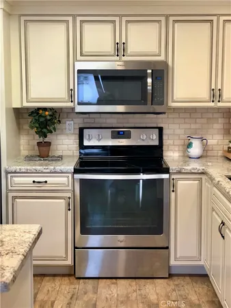 a kitchen with appliances and cabinets