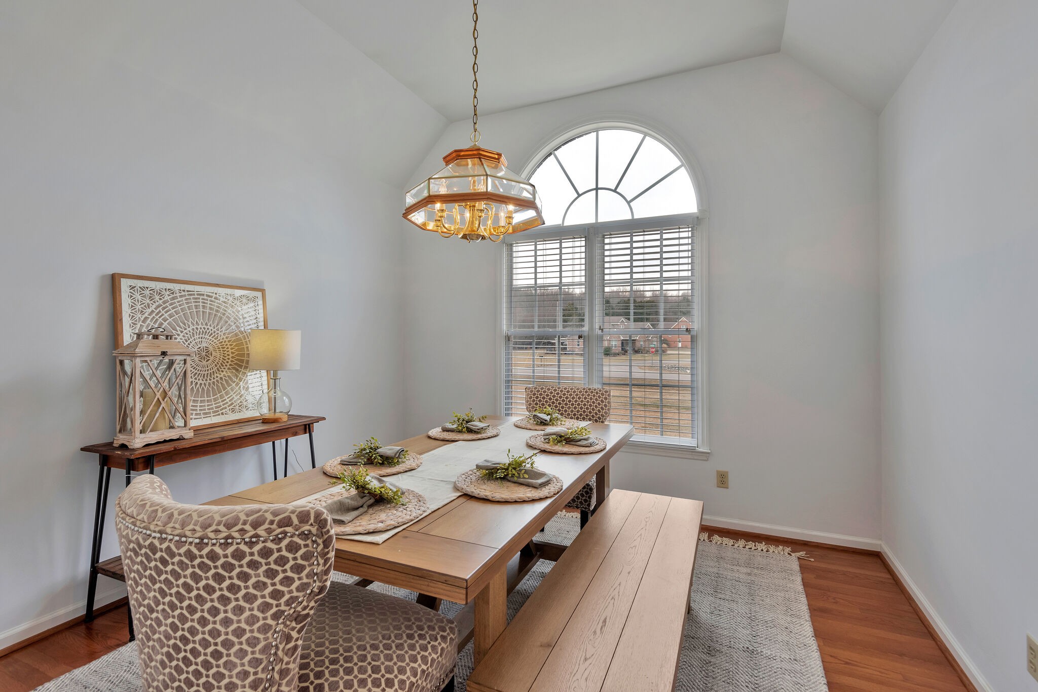 1102 High Lake Drive Dickson, TN 37055 - Photo 17 of 50 a view of a dining room with furniture a chandelier and wooden floor
