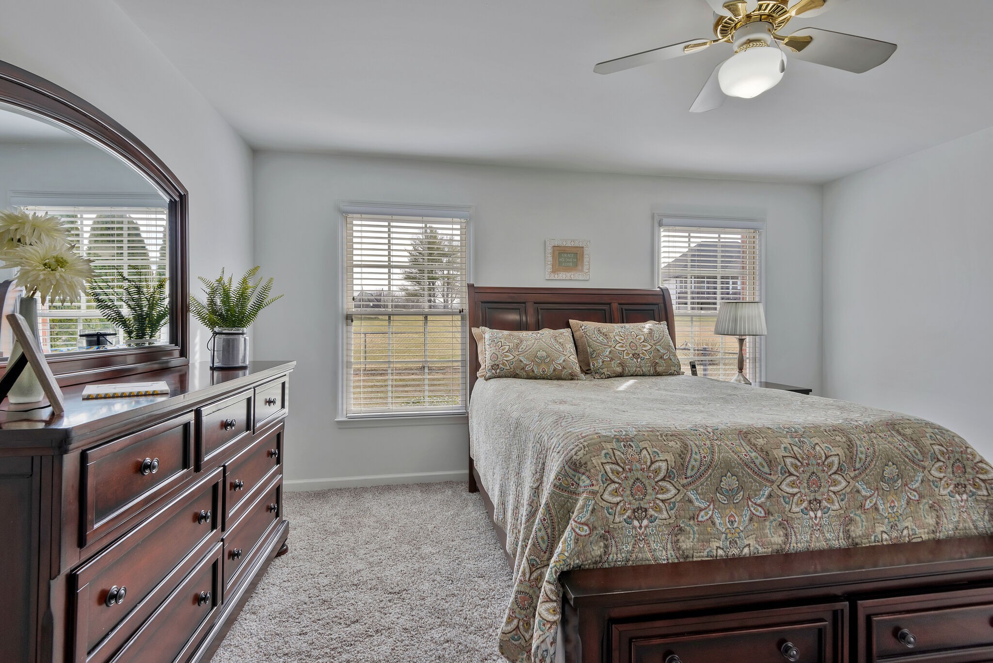 1102 High Lake Drive Dickson, TN 37055 - Photo 19 of 50 a bedroom with a bed and a chandelier